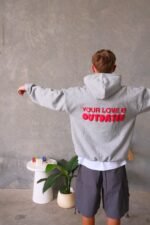 Grey and red hoodie with modern design for a stylish look